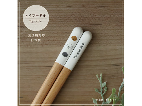 Toy poodle chopsticks